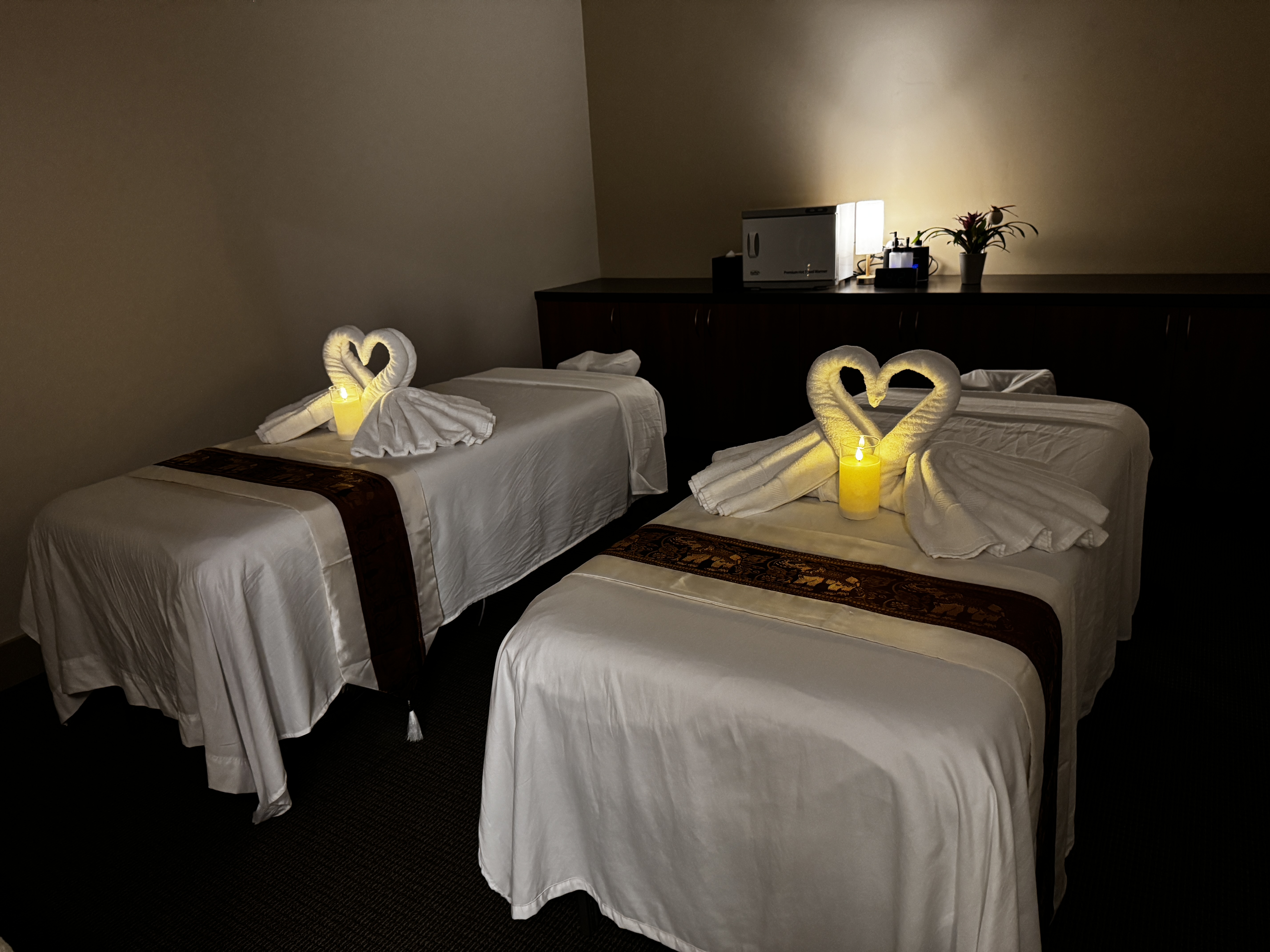 Intimate couples massage room designed for shared relaxation