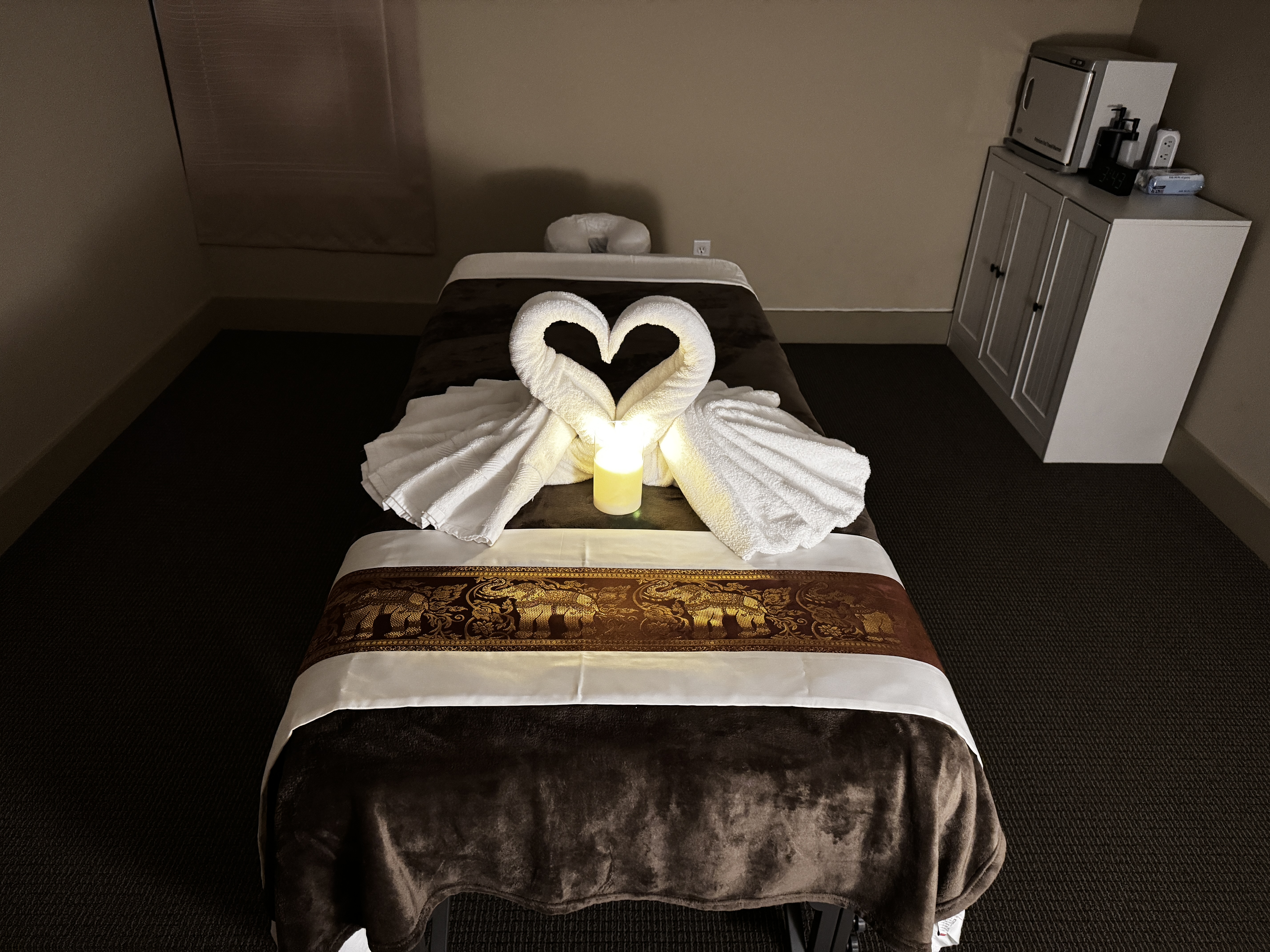 Serene single massage room with calming decor and lighting